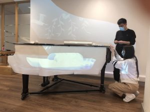 masking the piano with white paper
